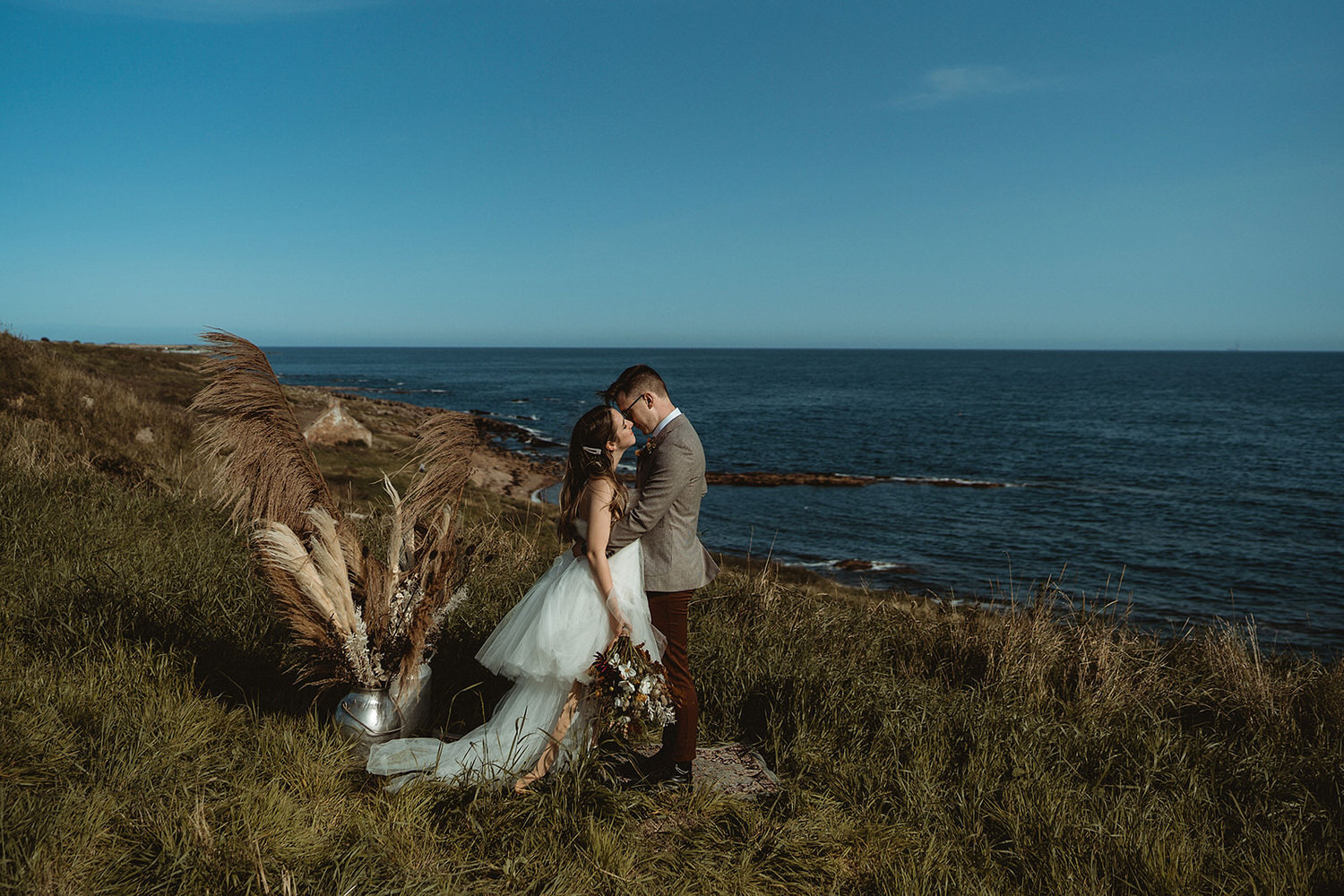 Ceremony set up for clifftop seaside elopement in Scotland