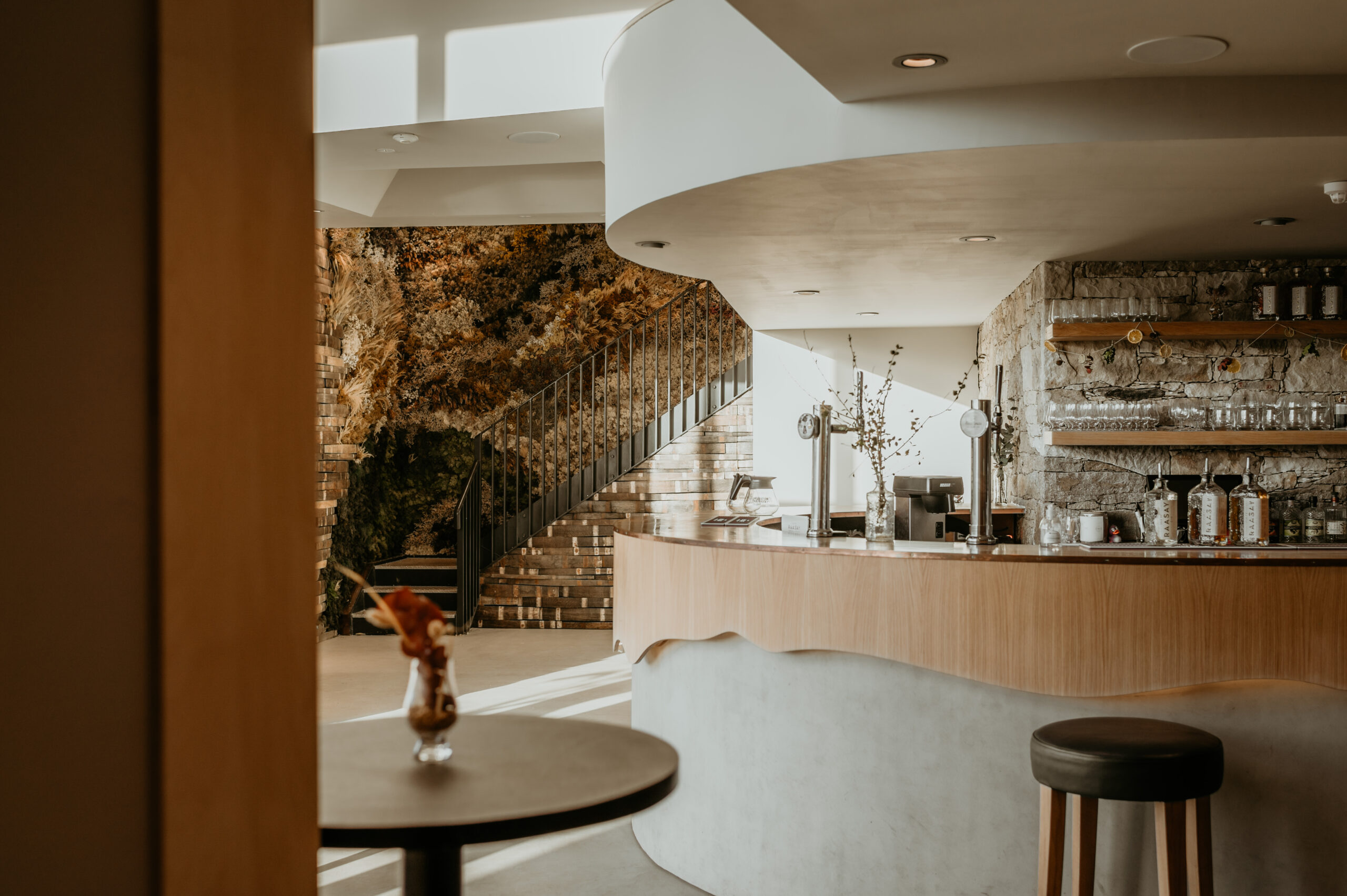 Modern staircase with dried wild floral installation