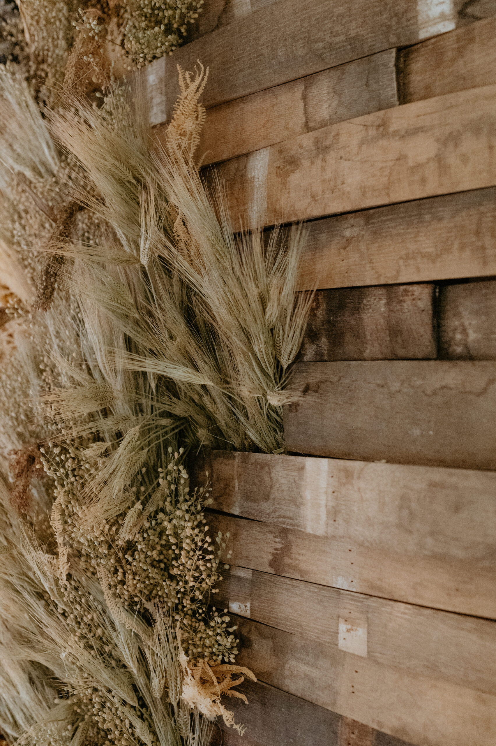 Close up of dried wild grass floral wall installation