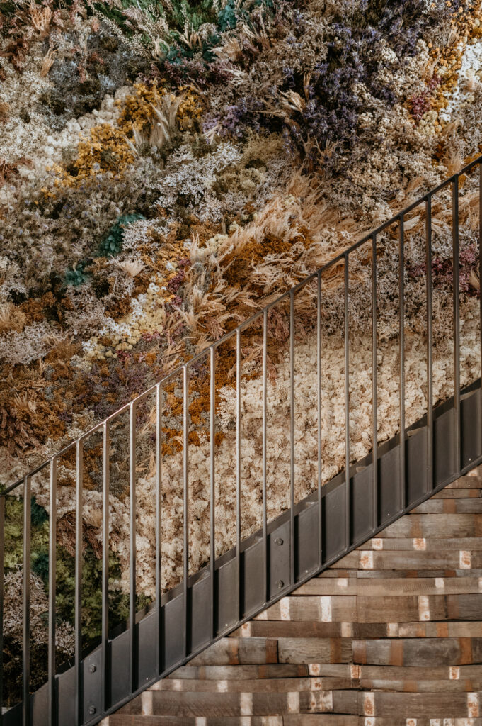 Modern staircase with dried wild floral installation