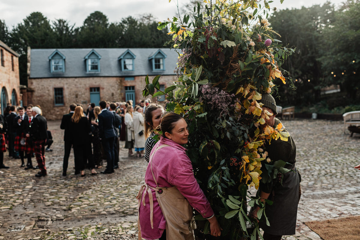 Floristry team moving flowers